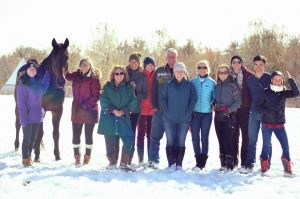 CHR staff and volunteers in the snowy pasture